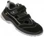 Preview: The shoe is a sporty, black sneaker with gray and white accents. It has three Velcro straps and a gray treaded sole. The upper is made of a soft, textured material.