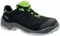 Preview: The shoe is a low, black work shoe with green accents. It has a breathable mesh upper and a non-slip rubber sole, ideal for safe walking.