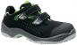 Preview: It is a black shoe with green accents. It has two velcro straps and a breathable upper with small holes. The sole is grayish and sturdy.