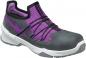 Preview: The shoe is a sporty, semi-open safety sneaker in gray and purple. It features a padded insole, elastic laces, and a sturdy rubber sole.