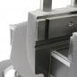 Preview: The image displays a section of a mechanical device, likely a precise mount. The surface is smooth and metallic, with sharp edges and textured areas.