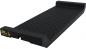 Preview: The image shows a long, narrow ramp piece made of black rubber. The surface has parallel grooves and a raised edge on one side. It likely serves as a driveway ramp.