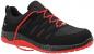 Preview: The shoe is predominantly black with red accents. It has a sporty design, flat laces, and a textured surface that provides good grip. The sole is red.