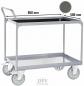 Preview: The image shows a sturdy serving cart with two shelves. The cart has a silver metal frame and is equipped with large, mobile wheels.