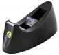 Preview: The image shows a black, oval tape dispenser. In the center, a transparent roll is visible, and there is a yellow label with a number on the front. The dispenser has a textured surface.