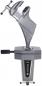 Preview: The image shows a sturdy metal table vise. It has a solid body with two clamping surfaces, which are pressed against each other with a screw.