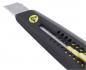 Preview: The image shows a black utility knife with a metal blade. The handle features yellow and black accents and holes for weight reduction. The blade is sharp and retractable.