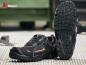 Preview: The image shows a pair of black safety shoes with a non-slip sole. They are lightweight and feature orange design elements. The sole has a deep tread for better grip.