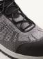 Preview: The image shows a sporty shoe in gray and black with breathable mesh material. The laces are black, and the sole is slightly raised.