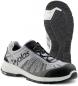 Preview: The image shows a gray sports or running shoe with black and white accents. The sole has a textured pattern for better grip. Laces are visible.