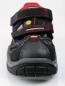 Preview: The image shows a black sports shoe with Velcro fastenings and red details. The sole is sturdy with a deep tread, ideal for outdoor activities.