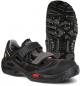 Preview: The image shows a black shoe with a sporty design. It features a padded collar, a wide Velcro strap, and a textured rubber sole with good grip.