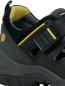 Preview: The image shows a black children's shoe with a breathable perforated pattern and a Velcro fastener. Yellow accents are visible on the top and the lining. The sole is sturdy.