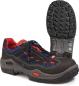 Preview: Das Bild zeigt einen dunklen, robusten Schuh mit rotem und blauem Netzmaterial. Die Sohle hat ein starkes, rutschfestes Profil. Der Schuh ist mit Schnürsenkeln ausgestattet.