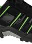 Preview: The image displays a section of a black athletic shoe with green accents. The sole is sturdy and textured, while the upper appears breathable with slight reflections.