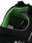 Preview: The image shows the interior of a black shoe with green lining. The sole is well-cushioned and provides comfort. A label with information is visible.