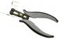 Preview: The image shows a pair of pliers with gray rubber handles and a black metal head. Next to the pliers are two thin, wire-like parts. The pliers have a spring-loaded opening and precise tips.