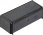 Preview: The image shows a black, rectangular plastic casing. It has rounded edges, a smooth surface, and is positioned horizontally. On one side, there are buttons and symbols visible.