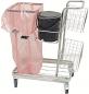 Preview: The image shows a cleaning cart with a large, transparent trash bag, a black bucket, and two open, metal storage baskets on the side. The cart has wheels.