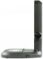 Preview: It is a gray screen reader or magnifier with a flat base. There are controls for magnification and a switch on a vertical stand.