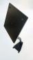 Preview: The image shows a black, rectangular bracket on a narrow base. The bracket has several holes for mounting. It is slightly tilted and appears stable.