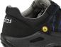Preview: The image shows a black work shoe with blue accents. The shoe features a reinforced heel cap and a profiled sole that provides slip-resistant properties. An ESD symbol is visible.