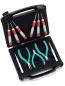 Preview: The image shows an open toolbox with black foam. Inside, there are various tools: four small screwdrivers with red handles, three pliers, and fine tweezers with colored handles.