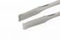 Preview: The image shows a metallic tweezer with a narrow, flat shape. The ends are slightly curved and have a wide opening, ideal for grasping small objects.