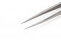 Preview: The image shows a narrow, metallic tweezer with pointed ends. The background is uniformly white, highlighting the tweezer clearly. It is long and precise.