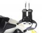 Preview: The image displays a technical device with two black handles and a round, flat holder. The holder features a rectangular opening and is equipped with screws.