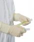 Preview: In the picture, there are two sample tubes in one hand, while the other hand is holding a green tube. The person is wearing beige gloves and a white coat.