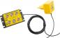 Preview: The image shows a yellow device with multiple ports. It has a bundle of cables leading to another yellow part with a plug. The surface is smooth and designed in a modern style.