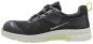 Preview: Der Schuh ist schwarz mit grauen und grünen Akzenten. Er hat eine atmungsaktive Oberseite, eine gepolsterte Sohle und eine innovative Schnürung. Sportlich und modern in der Form.