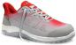 Preview: The shoe is sporty, primarily gray with red accents. It has a flat, non-slip sole and a breathable upper structure. The laces are visible.