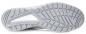 Preview: The image shows the underside of a gray sports shoe. The sole features a textured pattern with grooves and studs for better grip. The background is neutral and bright.