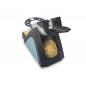 Preview: The image shows an electric transmitter with a round, golden brush on a black and blue casing. There is a handle on top with an opening where something can be inserted.