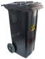 Preview: The garbage container is black, has two wheels for movement, and a removable lid. On the front, there is a warning sign with a yellow triangle.