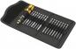 Preview: The image displays a toolset in a black storage bag. At the center is a screwdriver with a yellow handle. Adjacent to it are several bits in various lengths.
