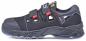 Preview: The image shows a black safety shoe with Velcro fastenings. It has a sturdy design, side ventilation slots, and a conspicuous, non-slip sole.