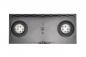 Preview: The image shows a rectangular, black plastic surface with two round openings on the sides. In the center, there is a small, round button. The surface is smooth and solid-colored.