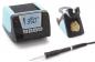Preview: The image displays a soldering iron kit. It includes a digital temperature display with buttons and a soldering iron that is attached to a stand. The dominant colors are black and sky blue.