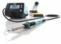 Preview: The image displays a soldering iron kit. It includes a digital temperature controller with a display, a soldering iron, and a stand with a sponge. The iron has a black handle and is silver-colored.