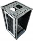 Preview: The image shows a computer case made of silver-colored metal. It has an open structure with vertical cooling slots and a compartment that provides space for components.