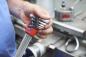 Preview: A hand holds a set of hex keys. The keys are in various sizes and arranged frontally. In the background, machines and tools are visible.