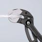 Preview: The image shows a pair of pliers with a dark, solid grip structure. The gripping surfaces are made of metal and have a sophisticated shape that is well-suited for holding objects.