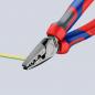 Preview: The image shows a pair of pliers with red-blue handles. It is half-open and holding a yellow-green cable. The pliers have a flat, black cutting surface and a textured exterior.