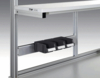 Preview: The image displays a metal structure with a horizontal rail profile. Below it, three black compartments are attached, which are likely used for storage or holding items.