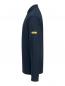 Preview: The image shows a long-sleeved, dark blue shirt. It has a high collar and there is a yellow label on one sleeve. The cut is sporty and simple.