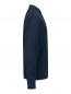 Preview: The image displays a long-sleeved top in a dark color, shown from the side. It features a buttoned collar and has a loose fit. The surface has a fine texture.