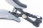 Preview: The image shows a tool with two contoured, ergonomic handles. At the end, there is a mechanism with a spring and an opening that is used for gripping or cutting.